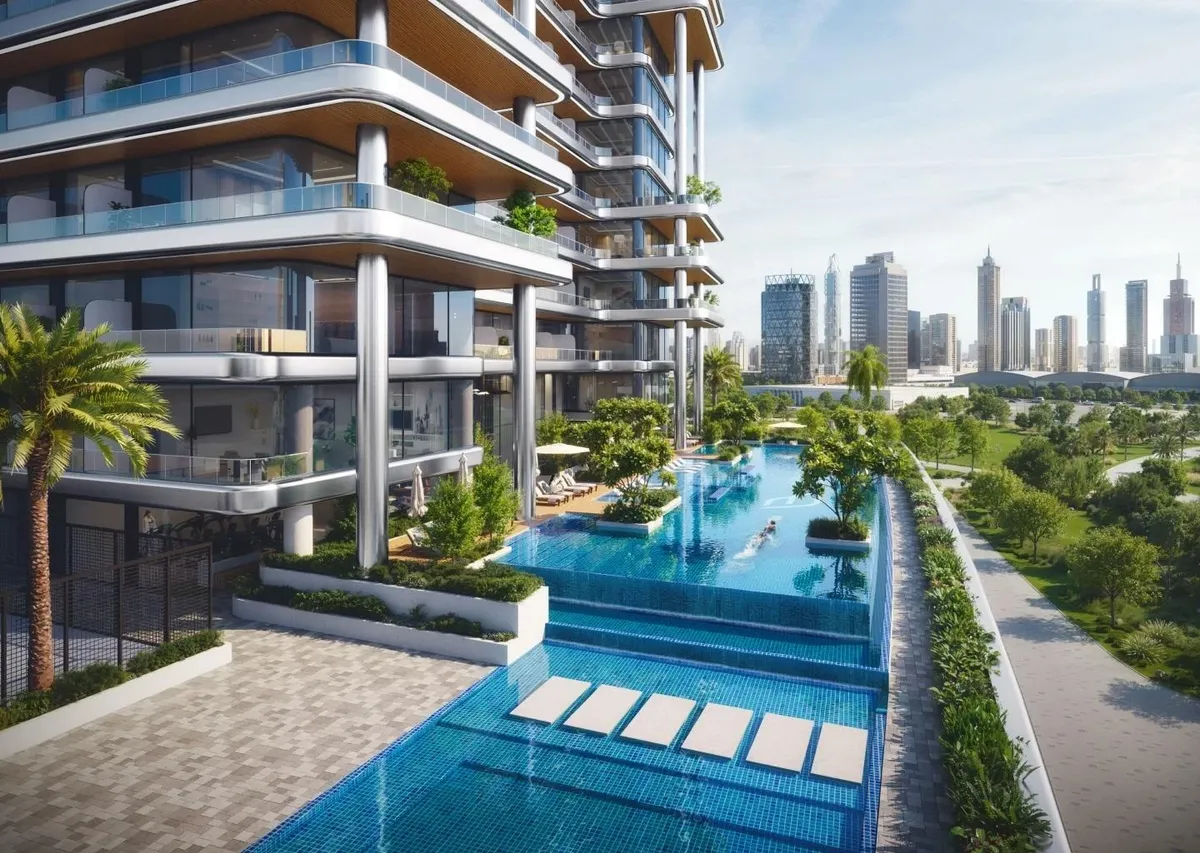 Render of the Binghatti Hillside podium pool with planted edges below the tower's curved balconies