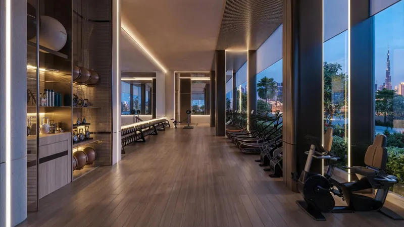 Render of the indoor gym at Binghatti Luxuria with floor-to-ceiling windows