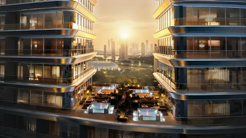 Render looking between the two wings of Binghatti Sky Terraces at sunset, over a landscaped terrace with seating