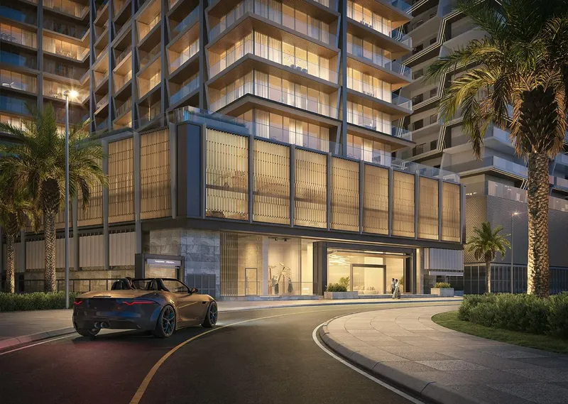 Render of the Binghatti Starlight entrance and podium screens lit at night