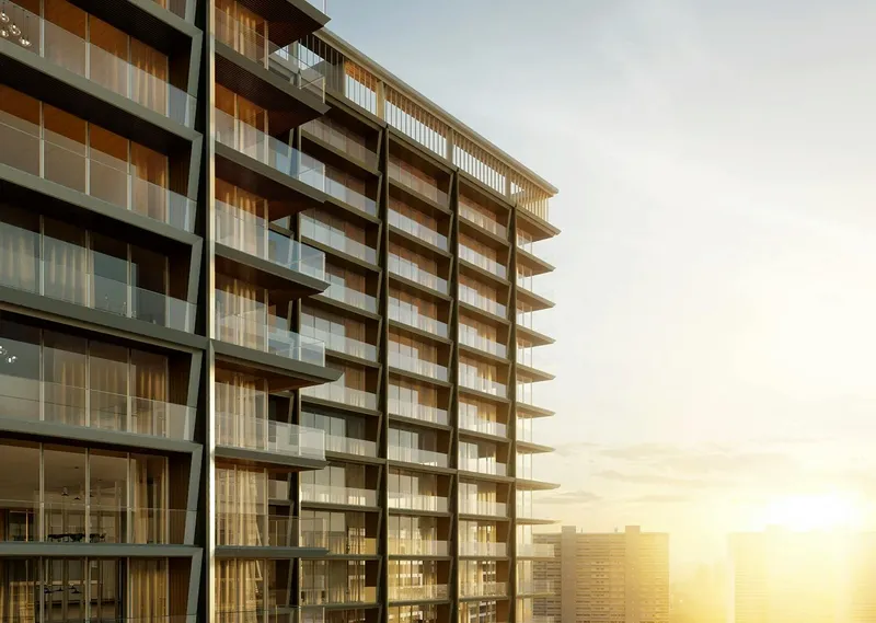 Render of the glazed balconies on the upper floors of Binghatti Starlight at sunset