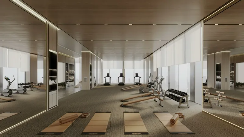 Render of the gym at Binghatti Titania with yoga mats and free weights