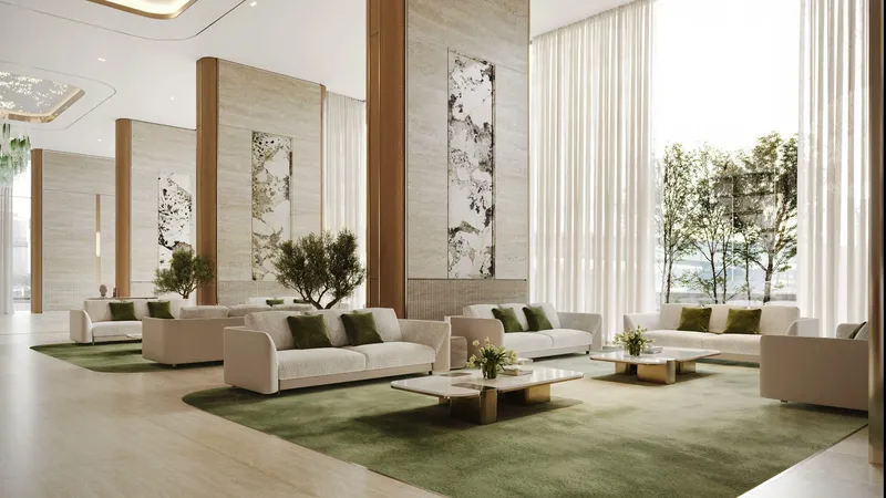 Render of the Binghatti Titania residents' lobby with cream sofas and green rugs