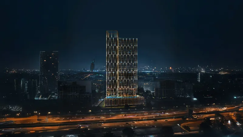 Render of the Binghatti Titania tower lit at night above the highway