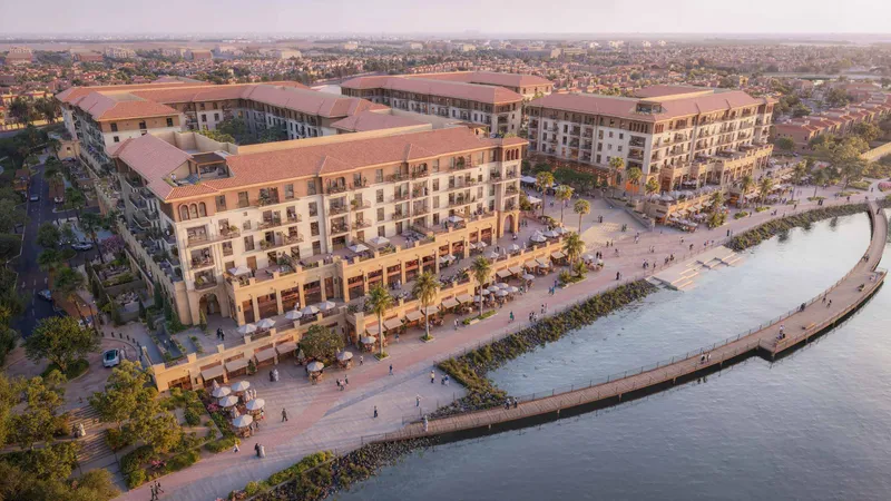 Aerial view of Alhambra at Bloom Living with the lake, bridge and promenade