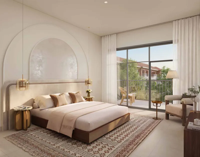 Master bedroom of an Alhambra apartment opening onto a balcony