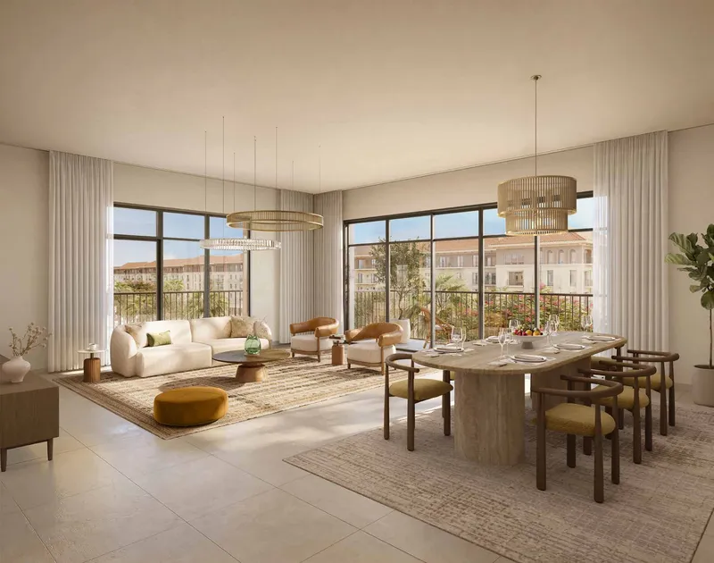 Living and dining room of an Alhambra apartment with full-height windows
