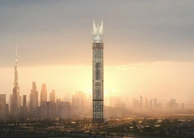 Render of the Burj Binghatti Jacob & Co Residences tower at sunset, rising above the Dubai skyline