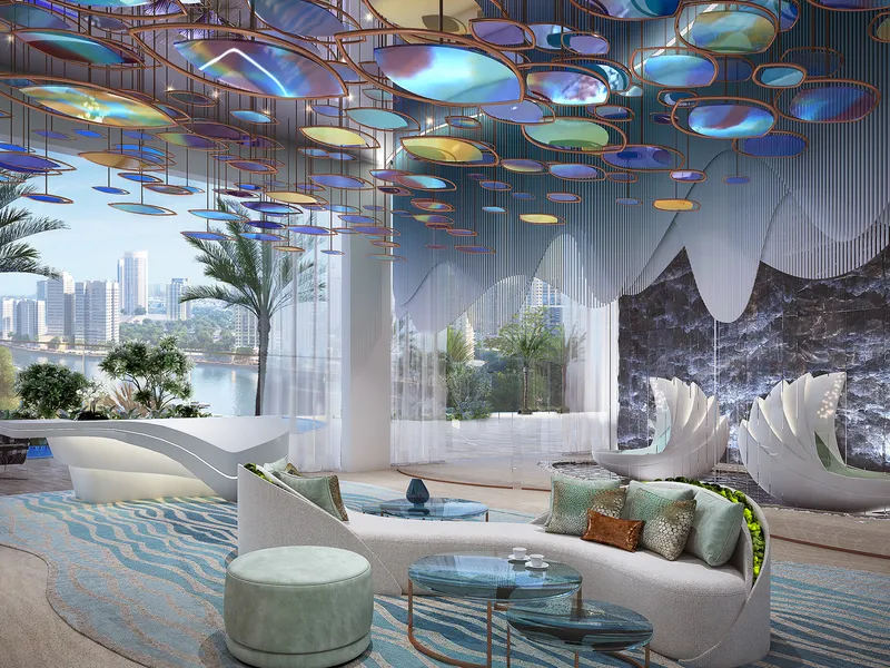 Lounge at Canal Heights with shell-shaped chairs and an iridescent ceiling installation
