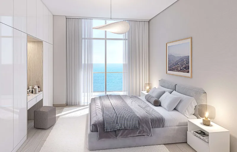 Render of a bedroom at Cape Hayat with a full-height window onto the sea