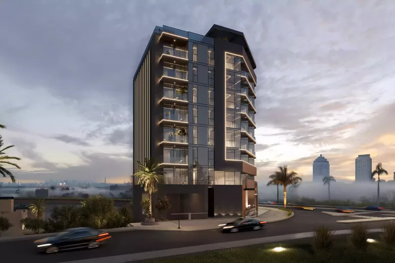 Celeste at dusk, showing the dark framed facade and stacked balconies