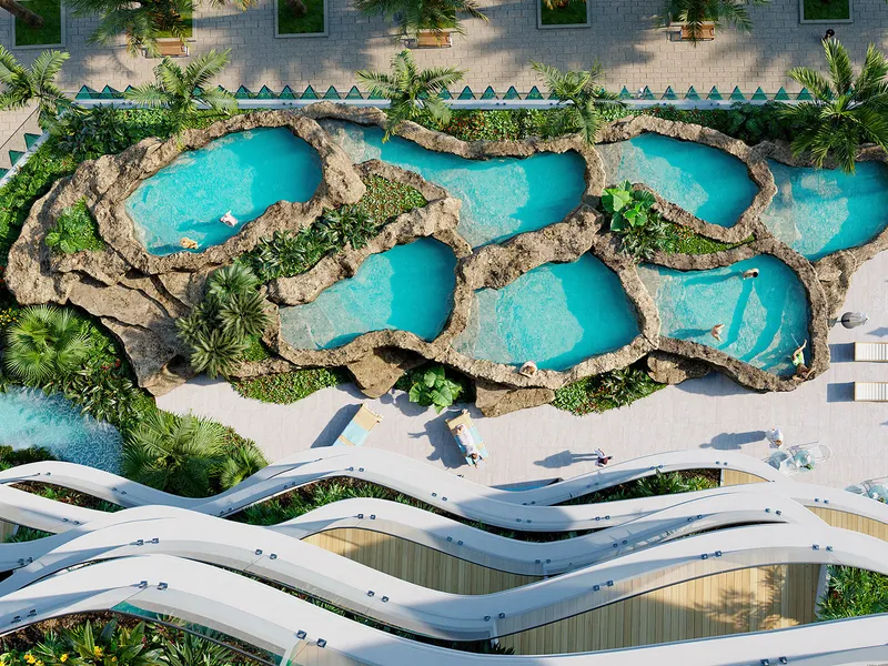 Overhead view of rock-edged bathing pools on the podium deck of Chic Tower