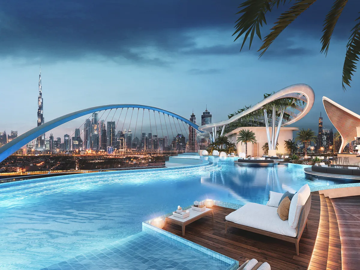 Podium lagoon at Couture by Cavalli at night, looking towards the Tolerance Bridge and the Downtown Dubai skyline