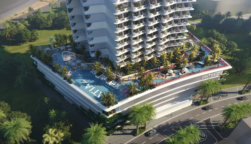 Aerial view of Cove by Imtiaz with its podium pool deck and palm-lined terraces