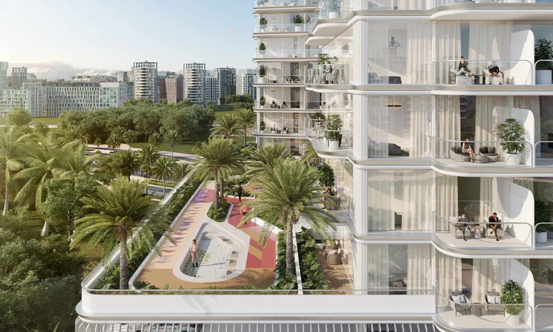 Balconies at Cove Grand by Imtiaz overlooking the landscaped podium deck and the green parks of Dubailand