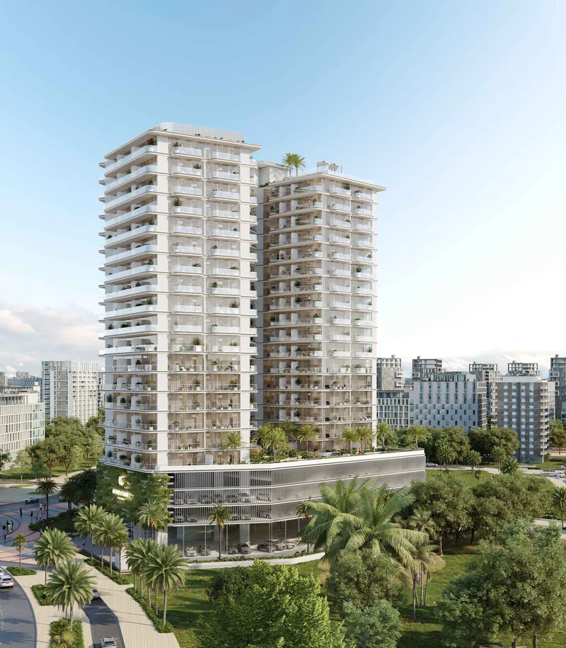 Cove Grand by Imtiaz, a white residential tower with deep balconies rising above a landscaped park