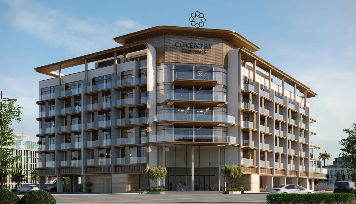 Coventry Residence, a mid-rise apartment building with glass balconies, bronze-edged floor slabs and a shaded roof