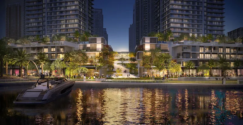 Render of the Creek Waters 2 podium and waterfront at night seen from the water