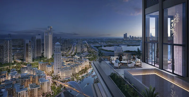 Render of an upper-floor terrace at Creek Waters 2 at dusk looking over Dubai Creek Harbour