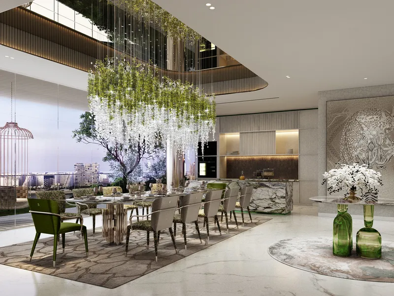 Open dining and kitchen area at DAMAC Bay 2 by Cavalli beneath a hanging floral installation