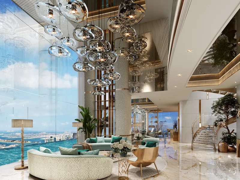 Double-height living room with a glass chandelier and full-height sea-view windows at DAMAC Bay by Cavalli