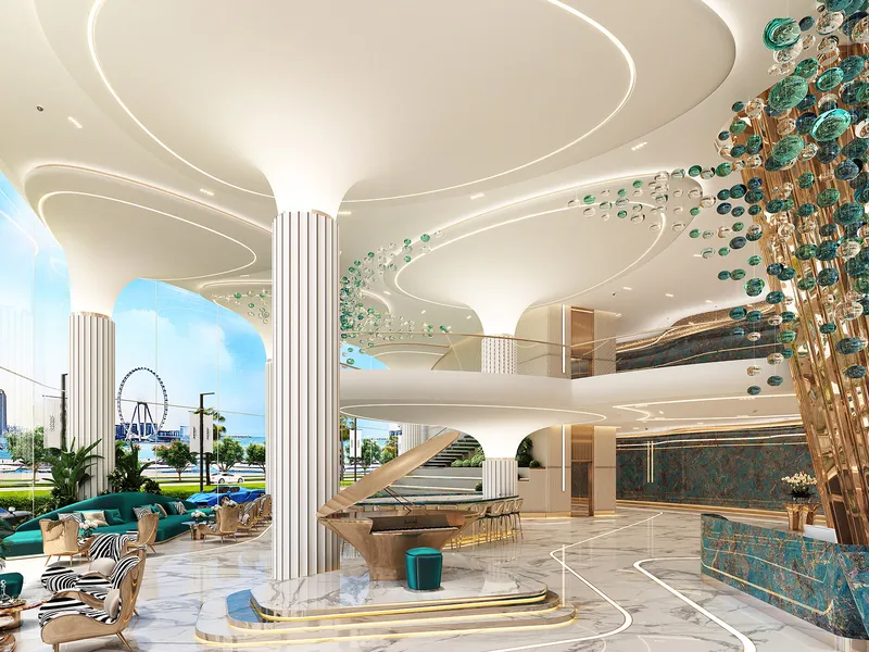 Lobby with fluted white columns, a sculptural tree feature and lounge seating at DAMAC Bay by Cavalli
