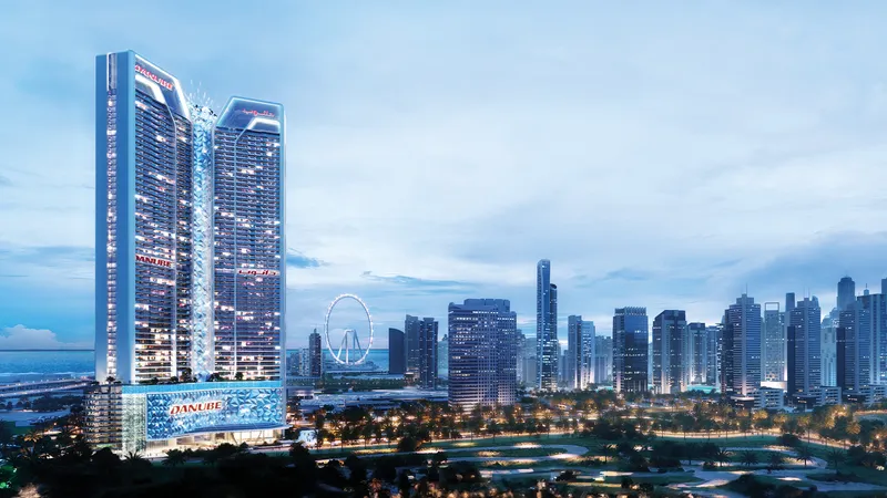 Diamondz by Danube tower at dusk with Ain Dubai and the skyline behind