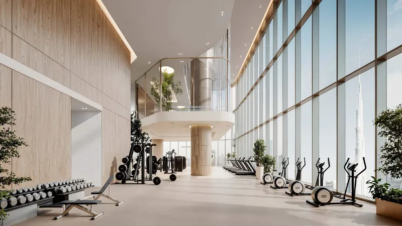 Render of the double-height gym at DWTN Residences with floor-to-ceiling windows