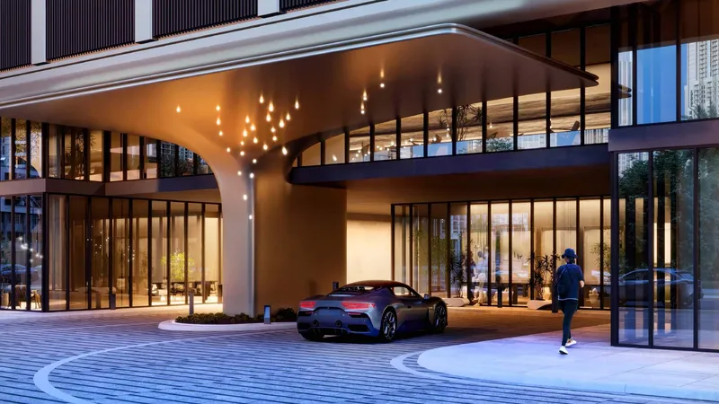 Render of the porte cochère and grand entrance of DWTN Residences at night