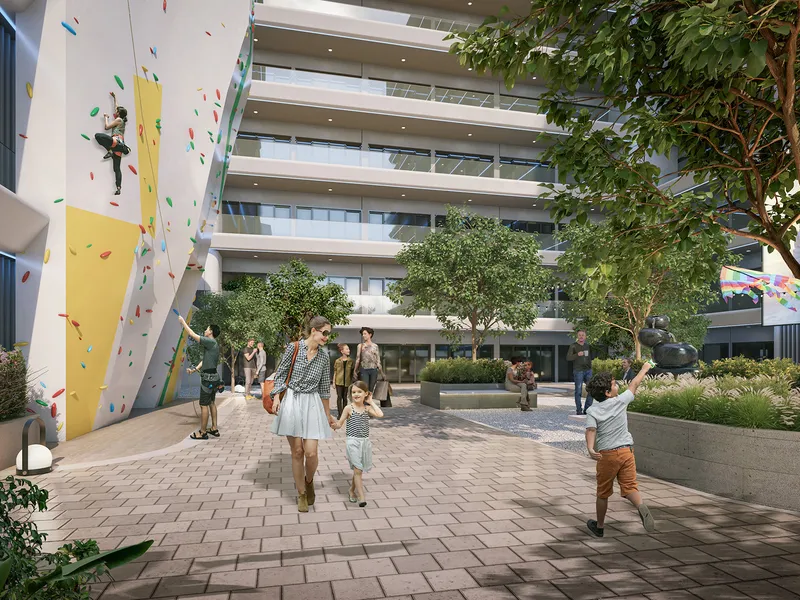 Outdoor climbing wall and paved courtyard at the base of ELO