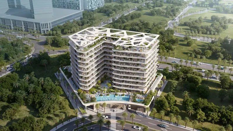 Aerial view of Enre Residence with its pool deck among green landscaping