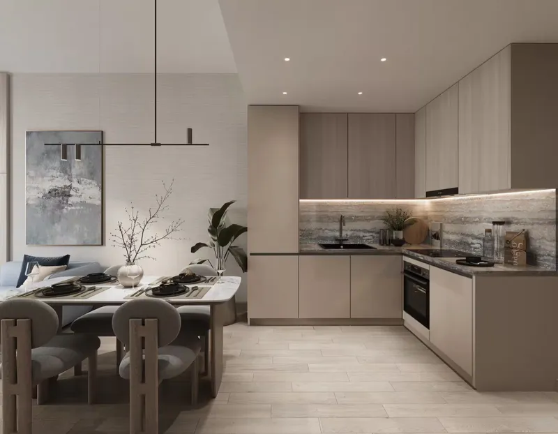 Open kitchen and dining area in an apartment at Enre Residence