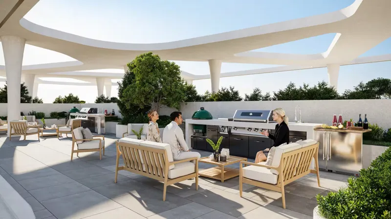 Shaded barbecue and lounge area on the deck at Enre Residence