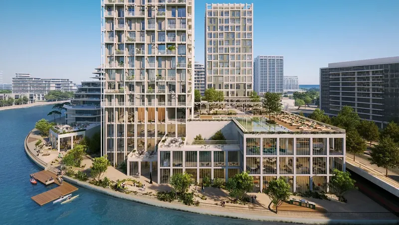 Render of Enta Mina and its neighbour HIVE above the waterfront promenade on Hayat Island