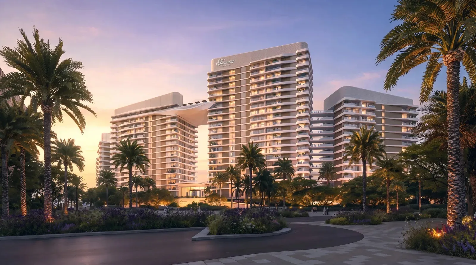 Render of the Fairmont Residences Al Marjan Island towers at dusk, with palm-lined landscaping in front