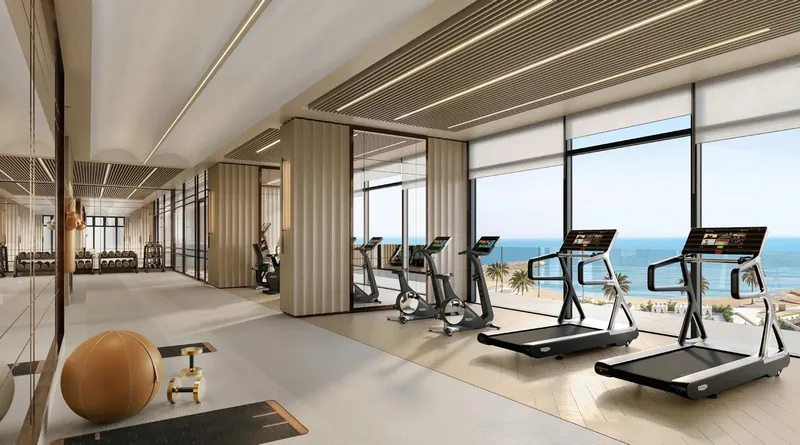 Render of the Fairmont Fit gym with treadmills facing the sea