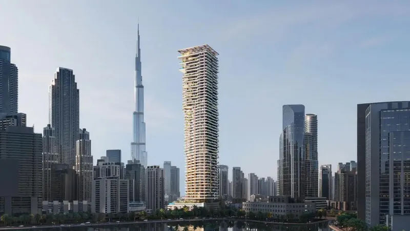 Fairmont Residences Solara Tower seen across the Dubai Water Canal with Burj Khalifa behind