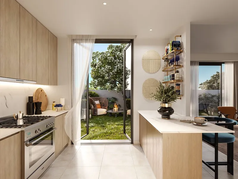 Interior render of a Fairway Villas 2 kitchen opening to the private garden