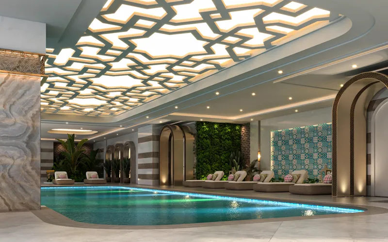 Render of an indoor pool at Faradis Tower beneath a patterned illuminated ceiling