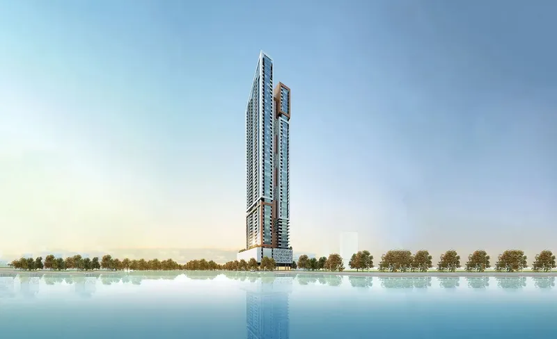 Render of Faradis Tower, a tall residential tower with copper-toned framing, seen across the water in Sharjah