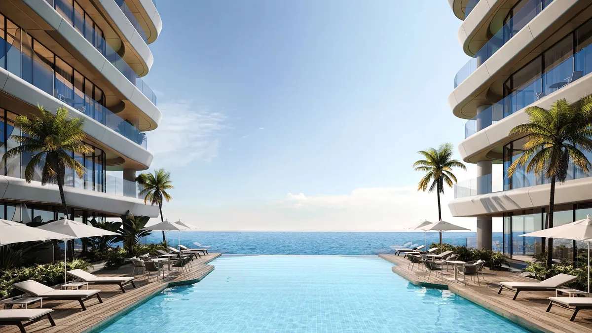 Render of the pool between the two wings of Gianfranco Ferré Residences, looking out to the Gulf