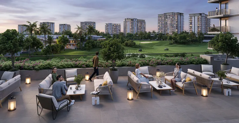 Render of residents on the Golf Dale outdoor terrace lounge at dusk with the golf course beyond