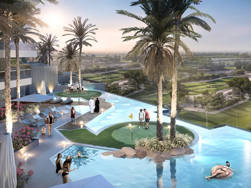 Pool deck at Golf Greens with a putting green on an island and the golf course beyond