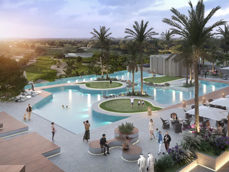 Aerial view of the Golf Greens pool deck with island greens, palms and seating