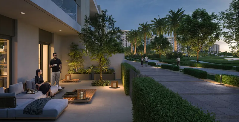 Render of a Golf Hills townhouse terrace beside a landscaped walkway in the evening