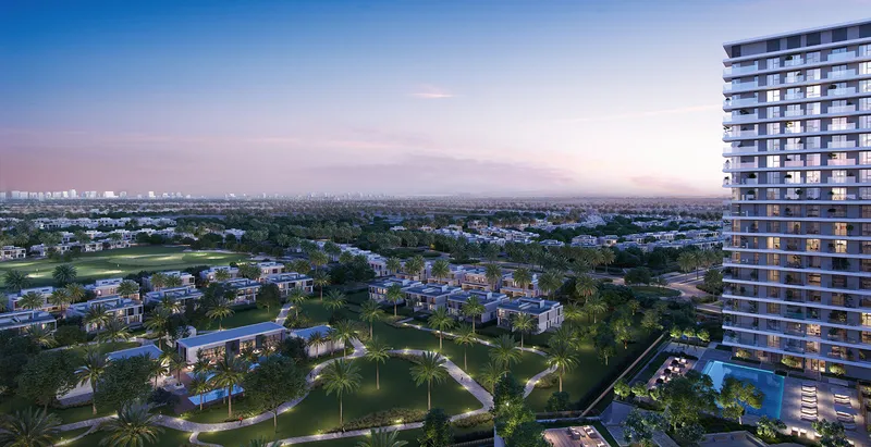Render of a Greenside Residence tower at dusk overlooking the villas and fairways of Dubai Hills Estate