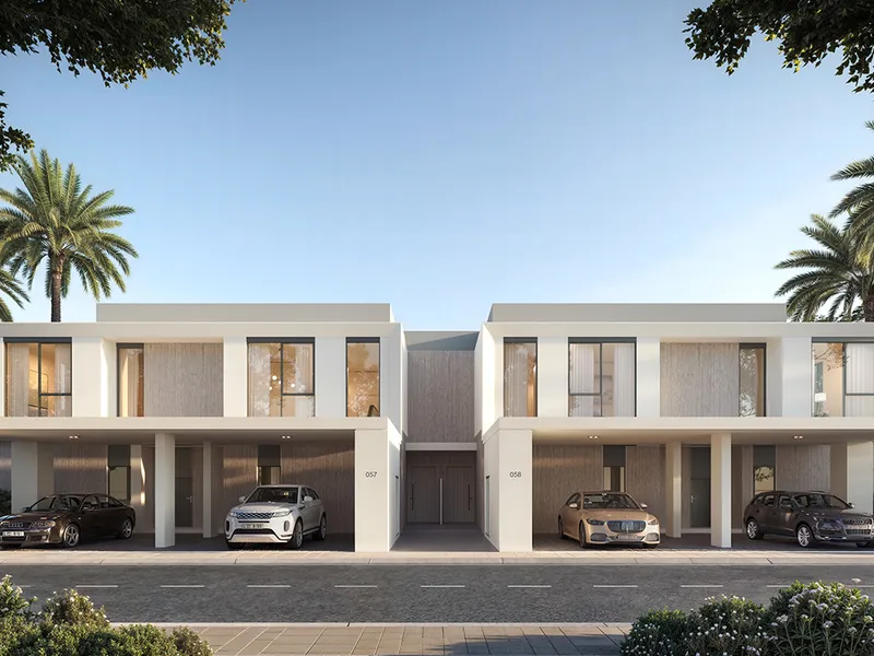Render of the street front of a pair of Greenway 2 townhouses with covered parking and palms