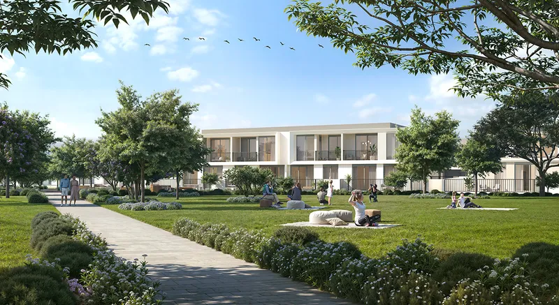 Render of Greenway 2 townhouses seen across a park lawn and footpath