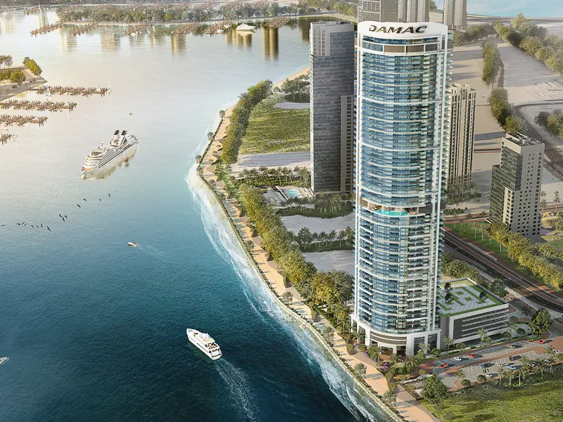 Aerial render of the Harbour Lights tower by DAMAC on the Dubai Maritime City shoreline, with yachts on the water