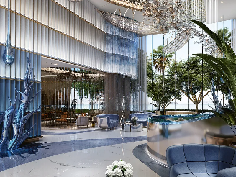 Harbour Lights lobby with blue lounge seating, sculptures and full-height windows